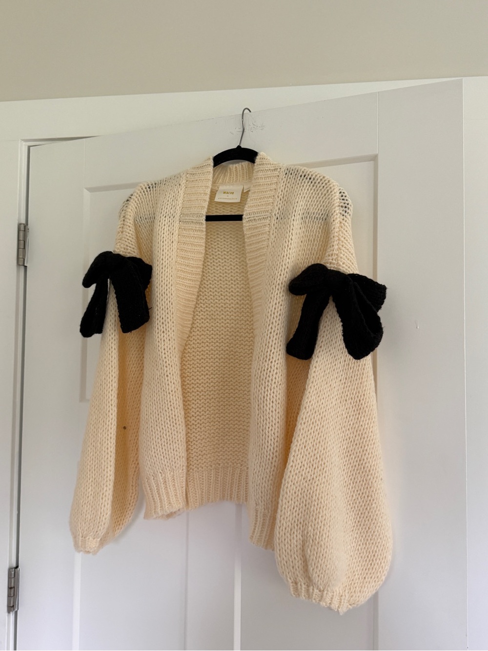 Anthropologie Cream Open Knit Cardigan with Black Bow Sleeves